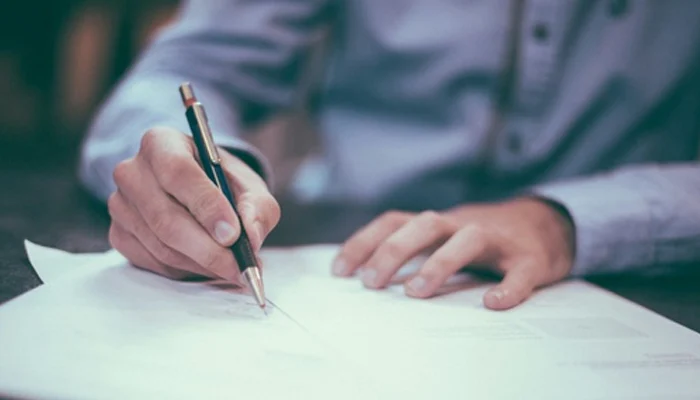 retirement advisor filling out financial paperwork